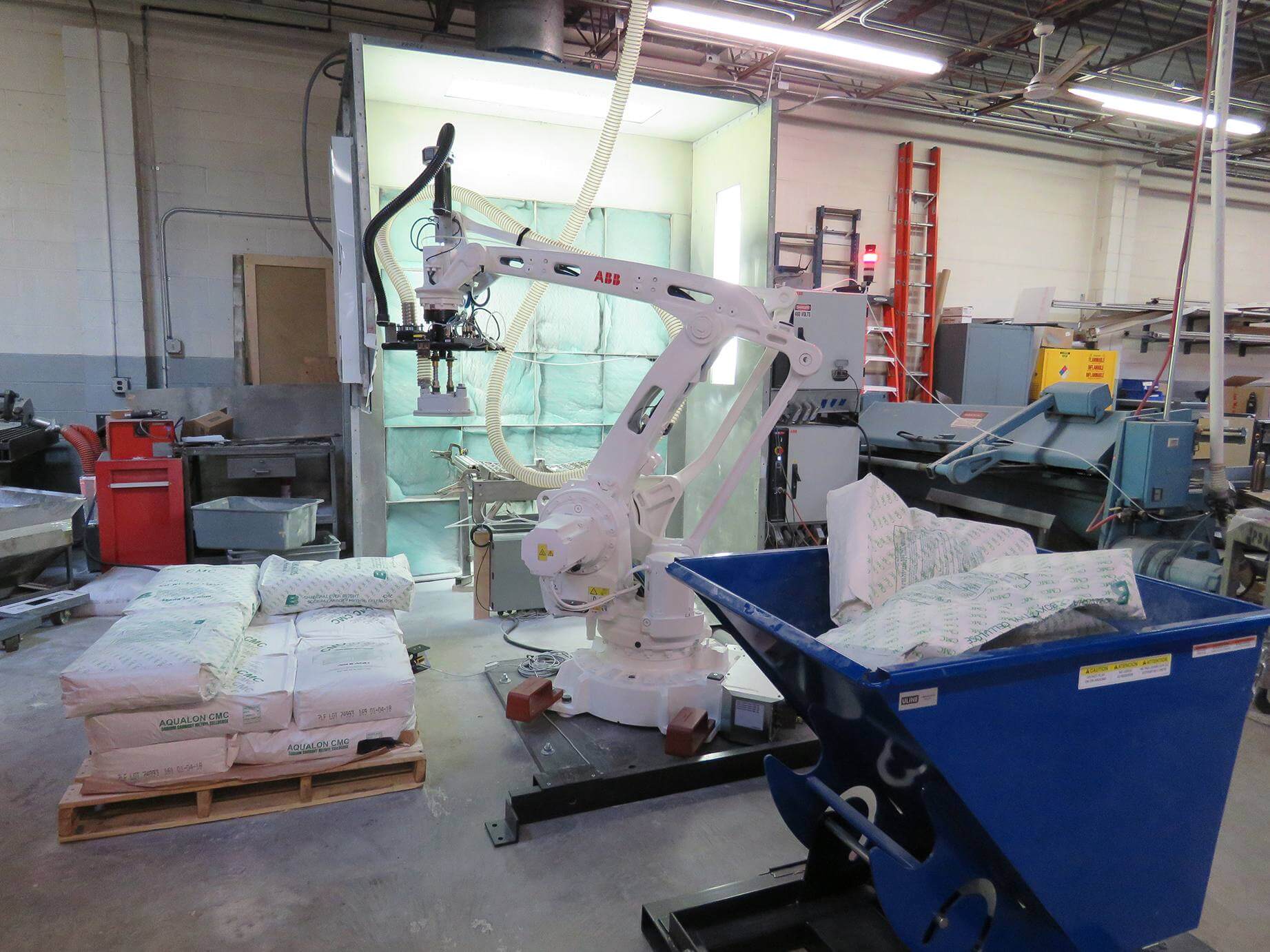 Palletizing robot arm moving bags